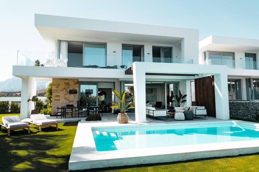 outdoor pool area with covered patio, backyard AV system, and premium lighting